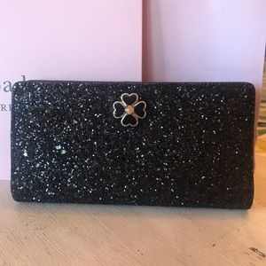 Kate Spade black glitter large slim bifold…